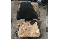 original seat from a Ford 4610 tractor in need of restoration